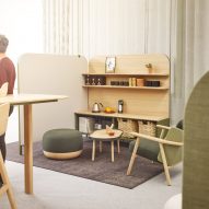 Figure in office with modular furniture system