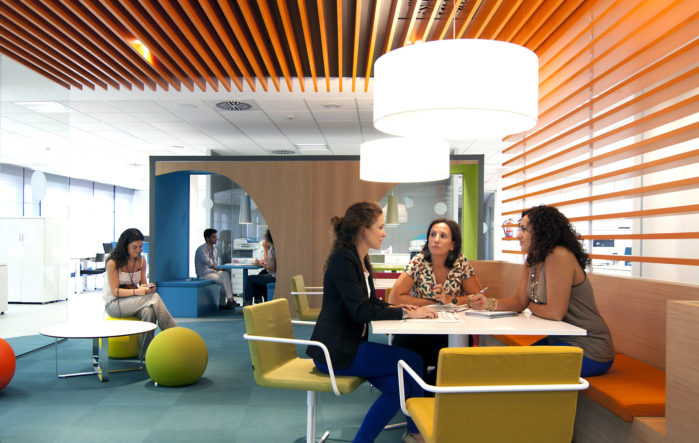 A photograph of students talking in a student cafe at IE University 