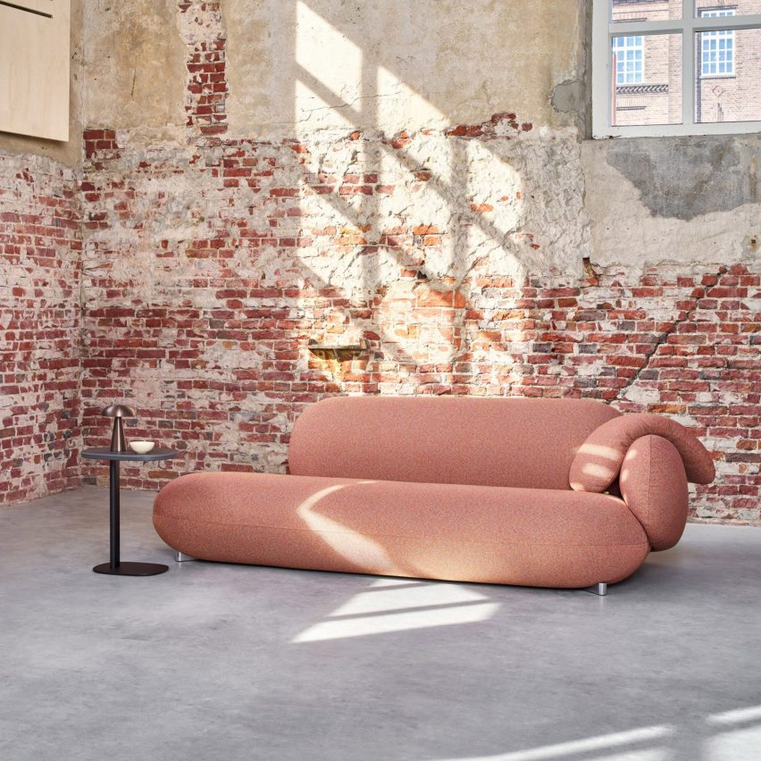 Photo of sofa against a brick wall