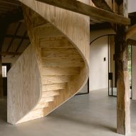 Plywood spiral staircase in Barn at the Ahof by Julia van Beuningen