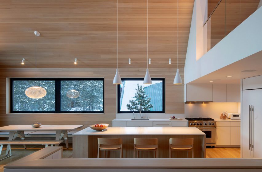 Kitchen with light wooden walls