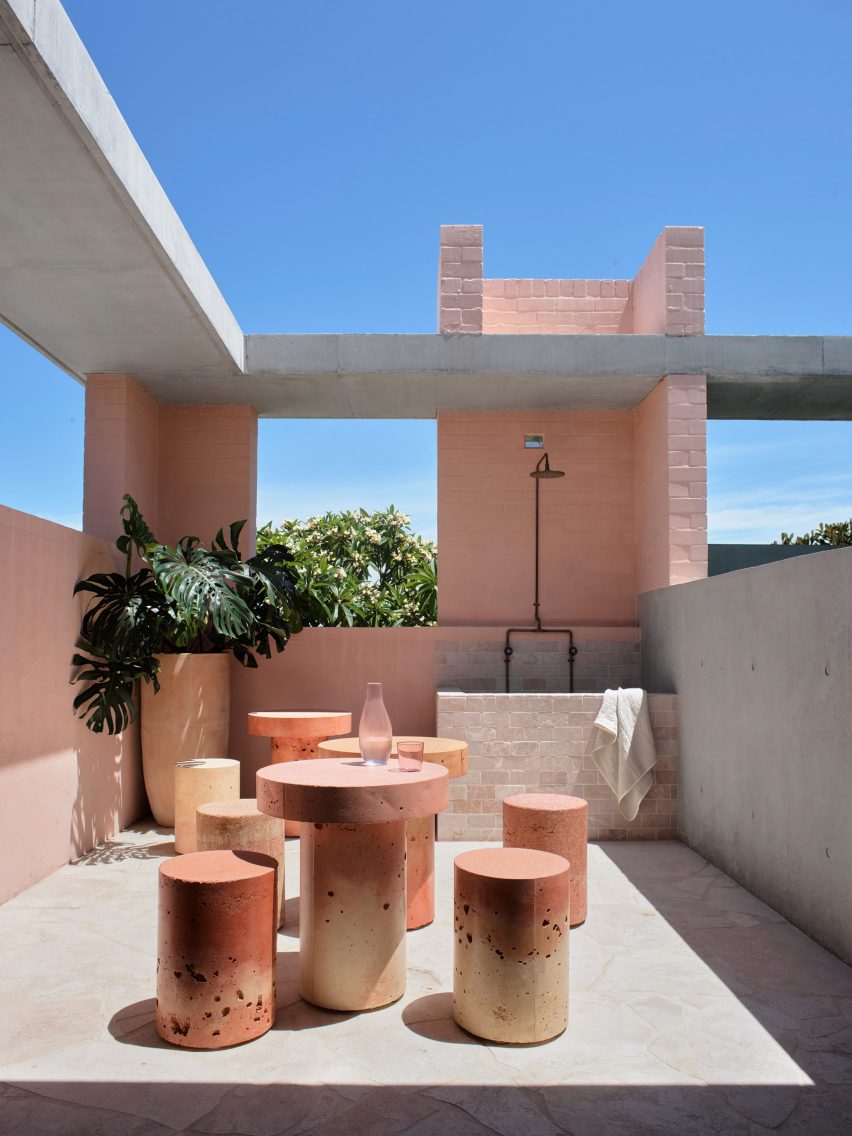 Courtyard of office in Sydney with pink stools