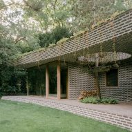 Brick extension opens up Dutch home to forested garden