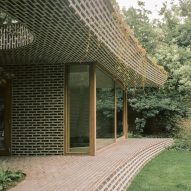 Brick extension opens rural Dutch home out towards a forested garden