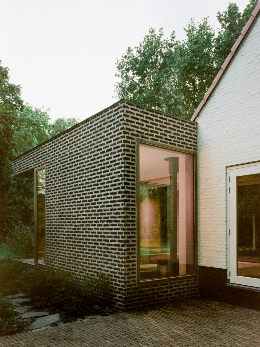Brick extension opens rural Dutch residence out in direction of a forested backyard