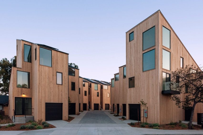 Timber-clad street of houses in modern-style housing development