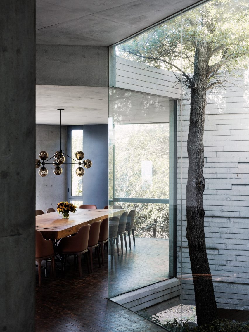 Dining room with table and chairs with views of the surrounding landscape 