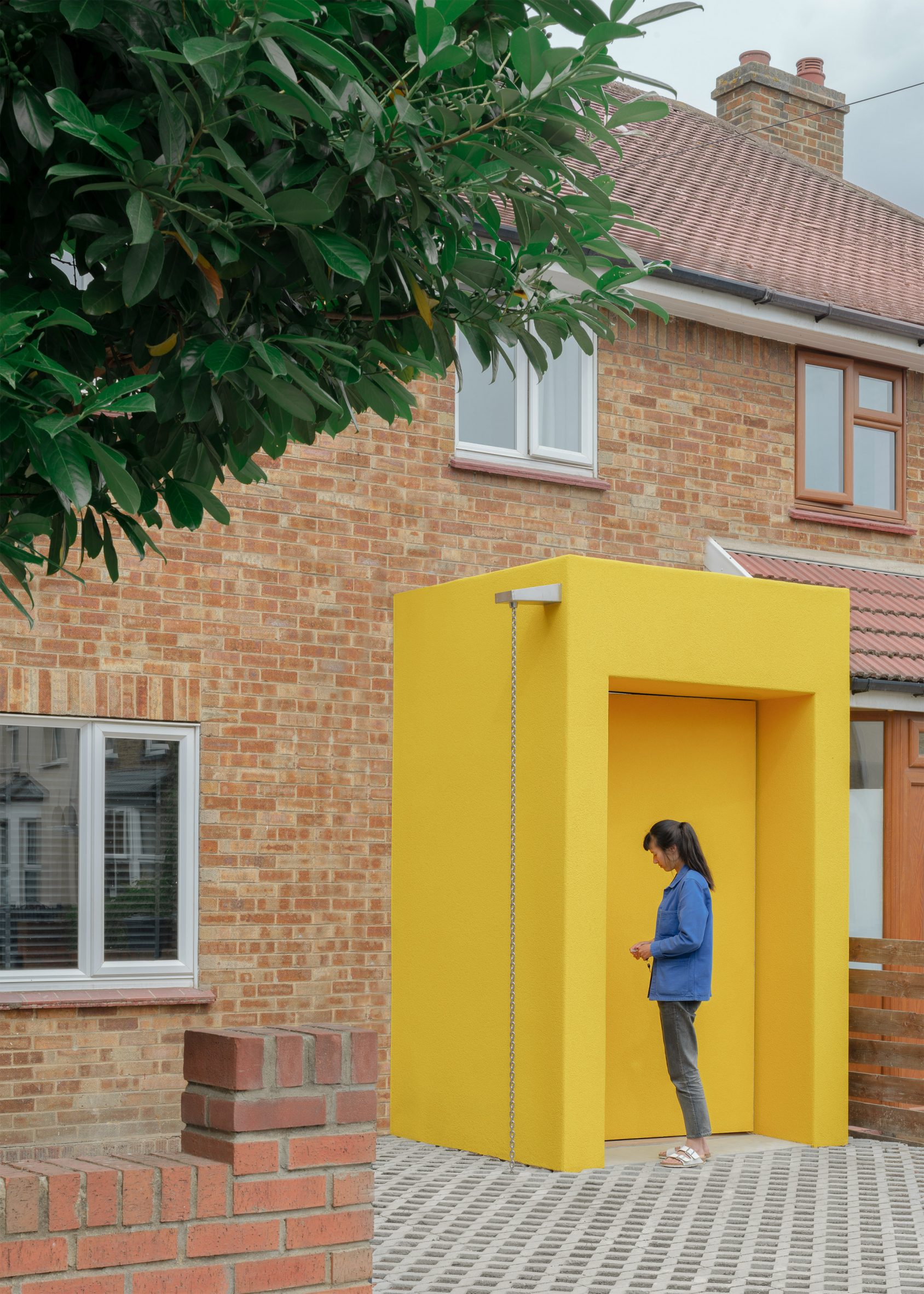 Front door with bright yellow cover