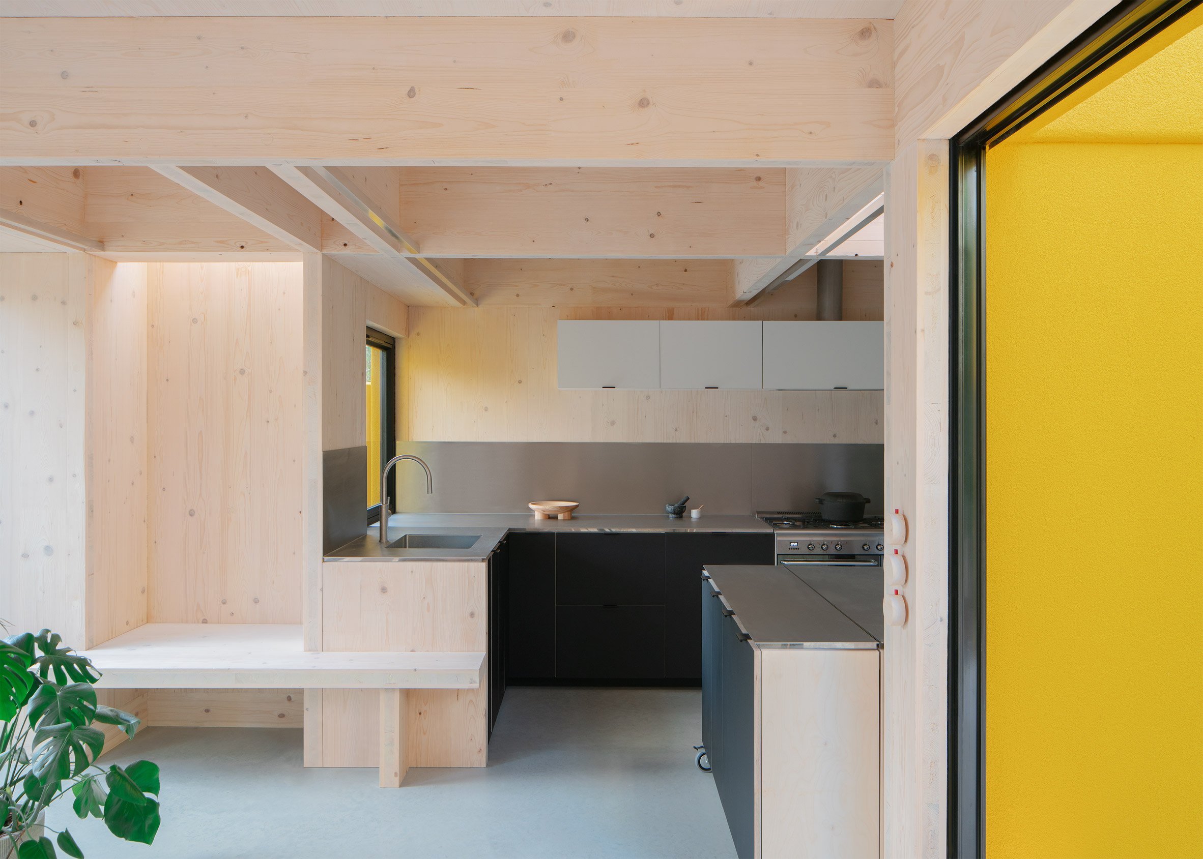 Kitchen with exposed timber structure