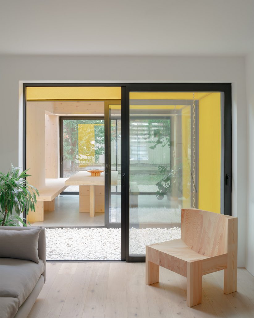 Yellow Render Unknown Works finishes CLT House extension with bright yellow render ...