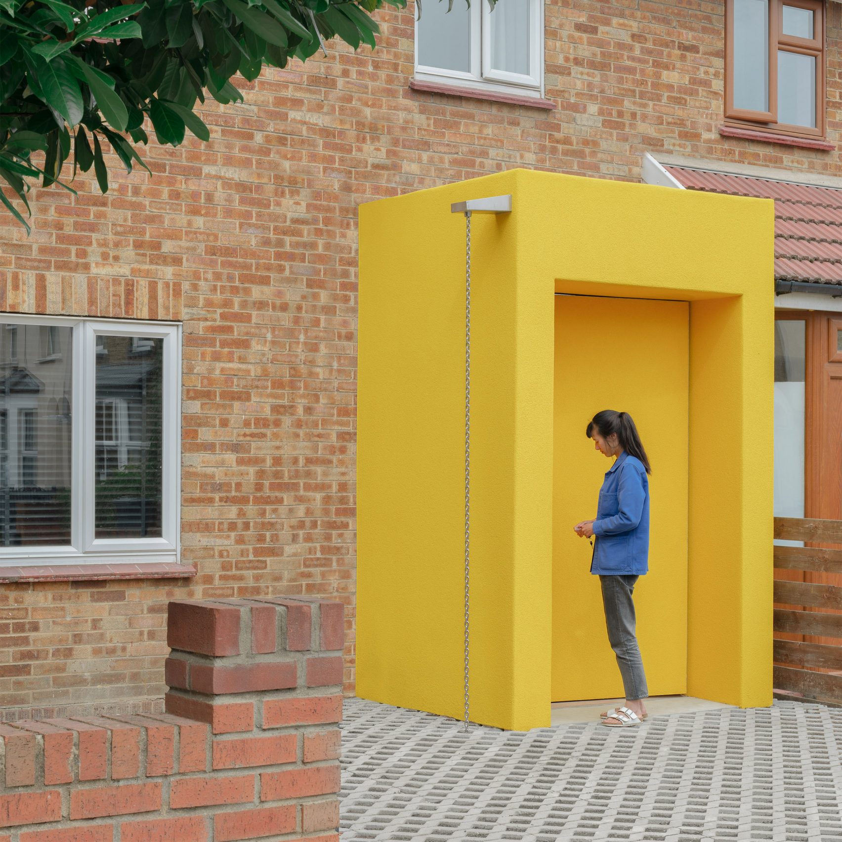 Yellow Render Unknown Works finishes CLT House extension with bright yellow render ...