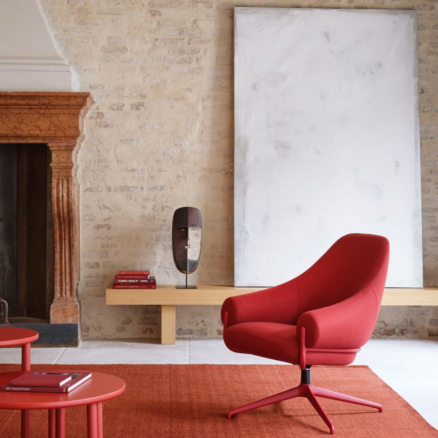 Red chair in minimal interior with fireplace