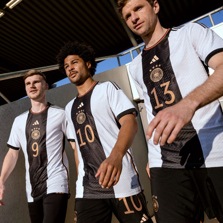 Three German footballers in white shirts