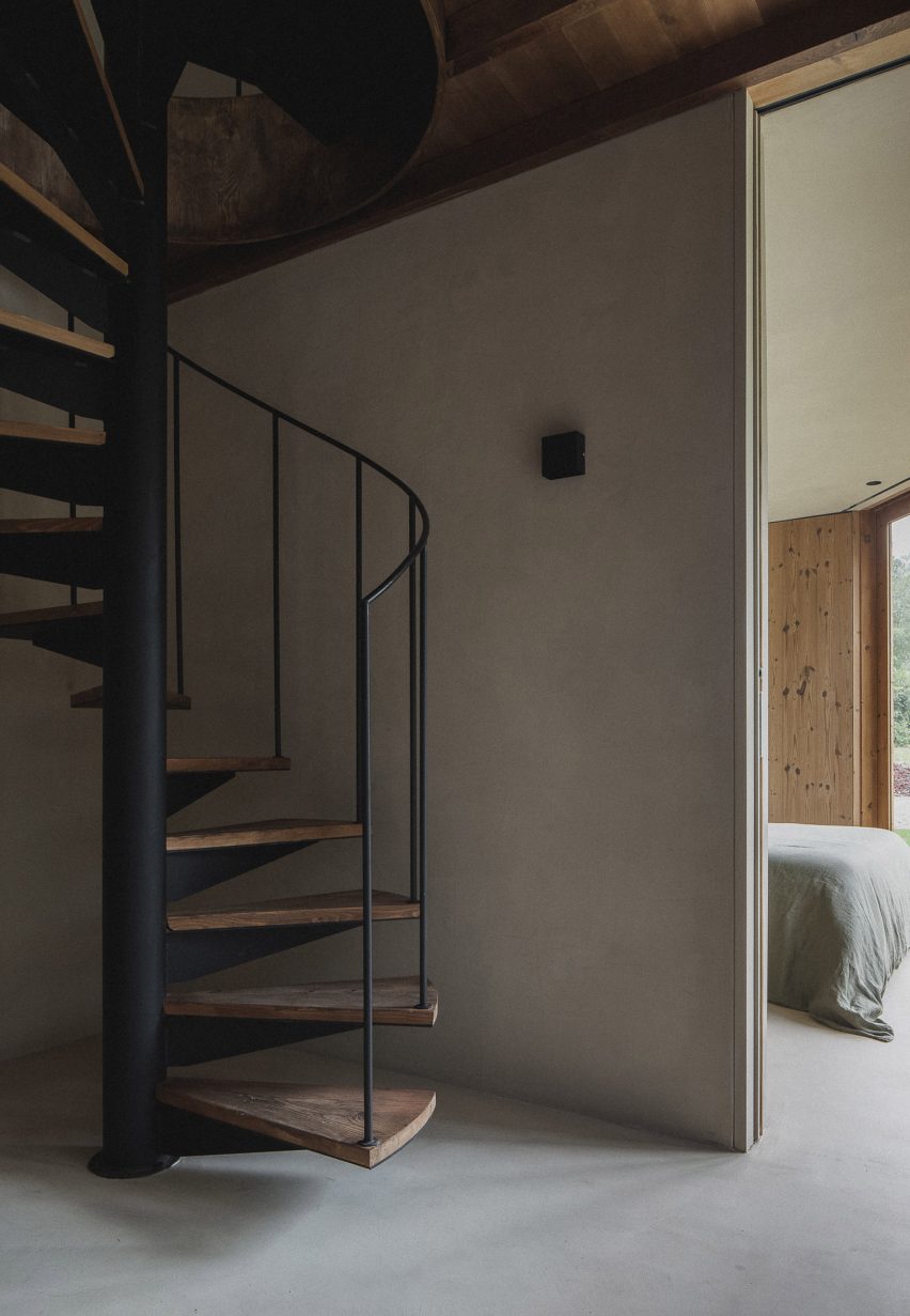 Spiral staircase in Granary House guesthouse by MIMA Housing