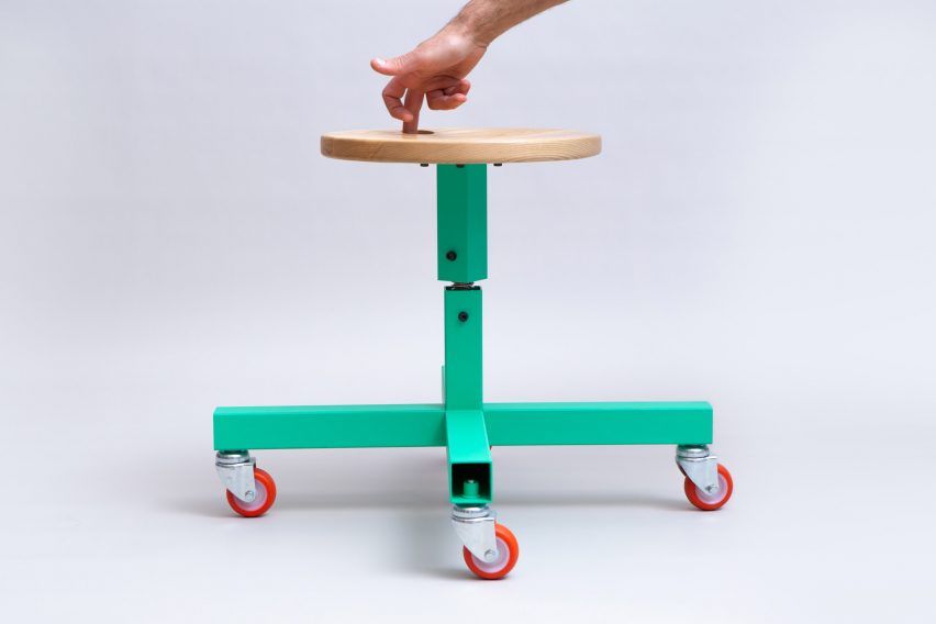 Photo of the Hour Stool with a hand twisting the seat