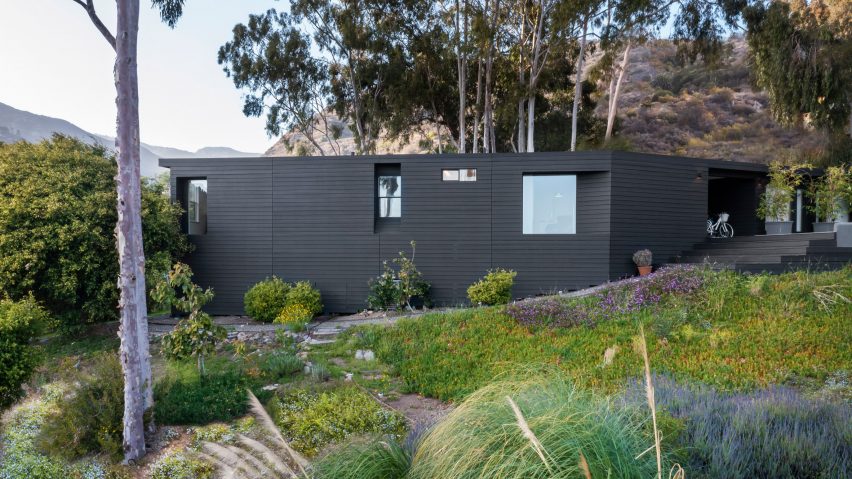 A black house overlooking the mountains
