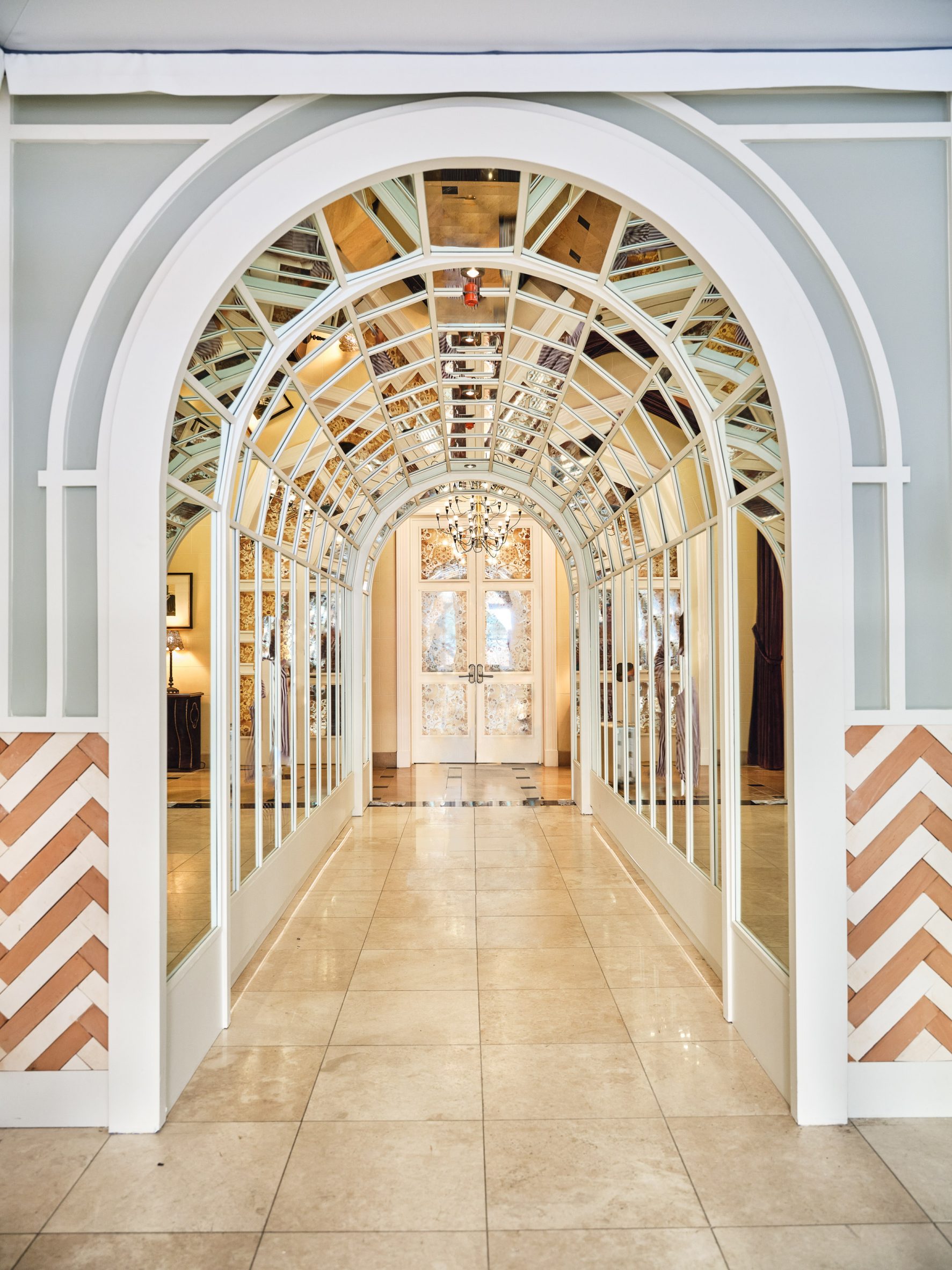 A mirror-lined arched gallery