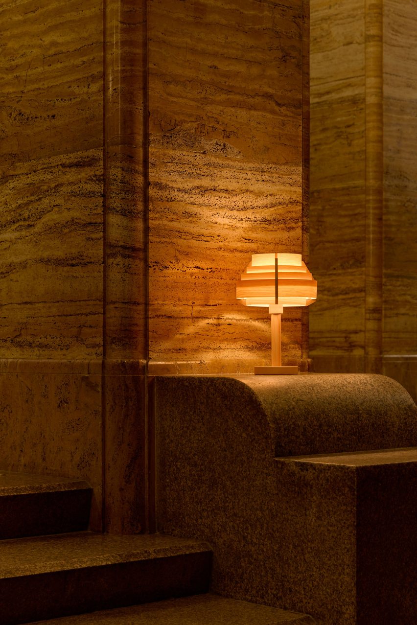 Orange glowing table lamp in low-lit interior