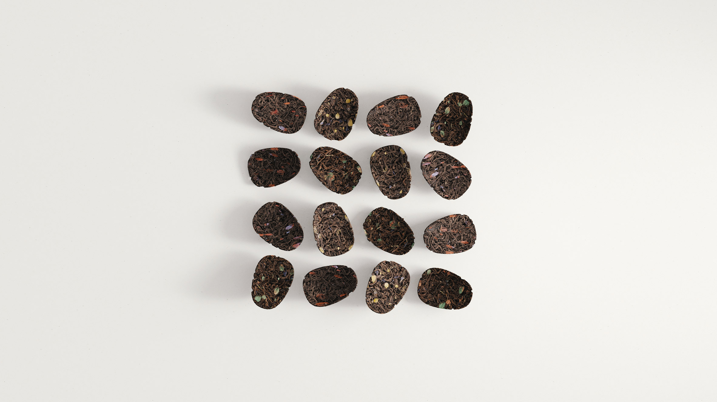Rendering of 16 Keia Ayahuasca Pucks for microdosing made of compressed tea leaves