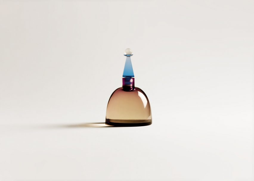 A coloured glass bottle of perfume