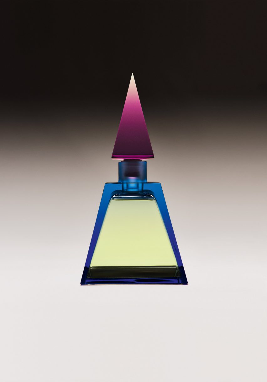 A Lalique perfume bottle with a pointy cap