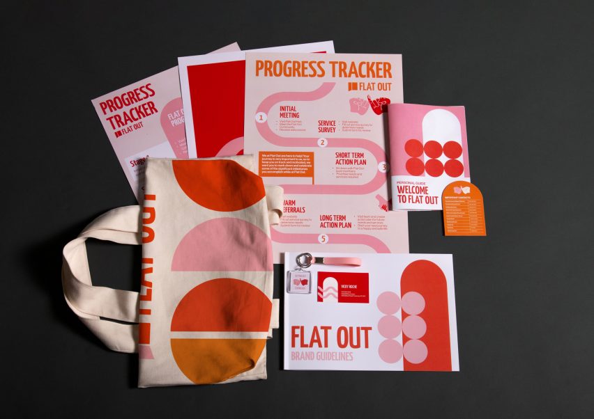 Papers and tote bag with red, pink and orange geometric prints