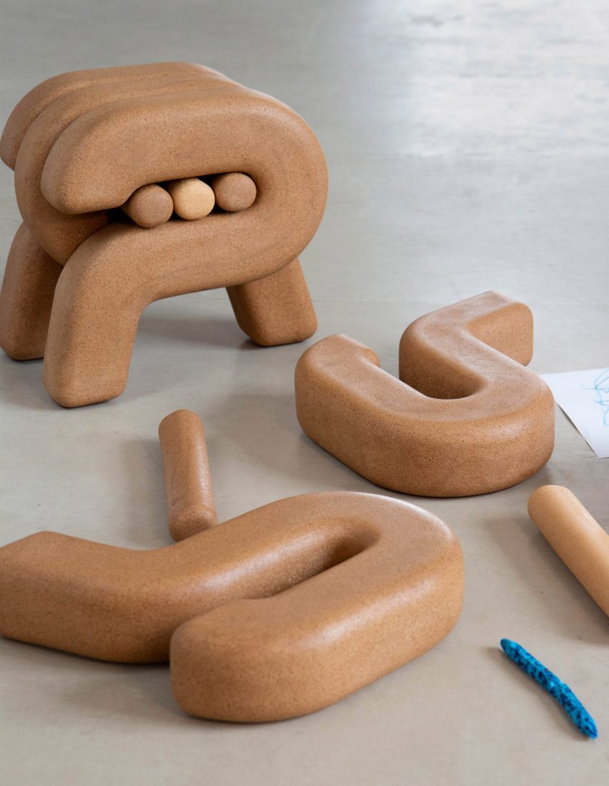 Nontalo stool in background with pieces disassembled in foreground
