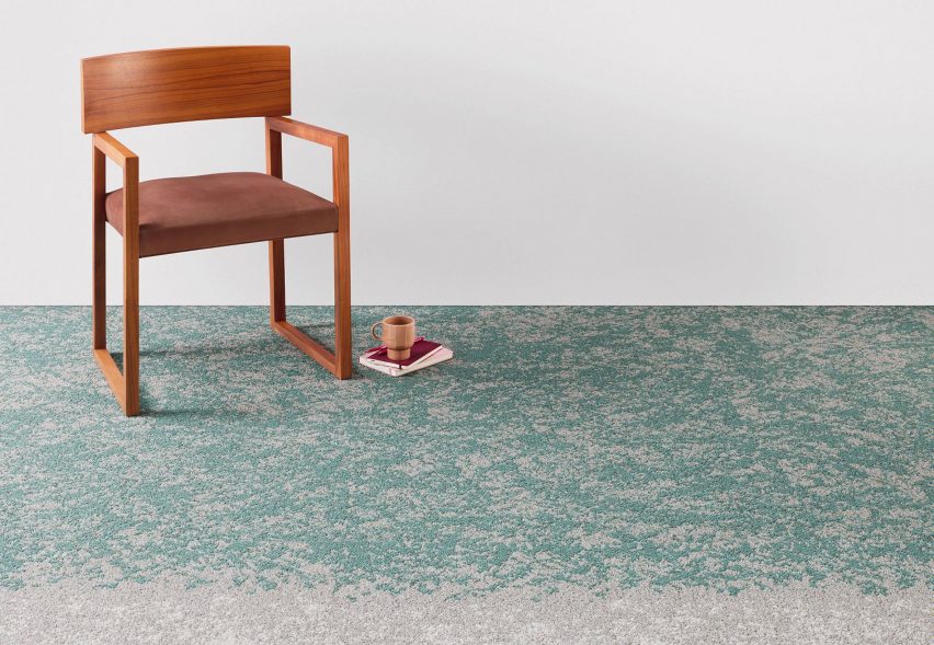 Shifting Fields carpet tiles by Shaw Contract with an orange chair