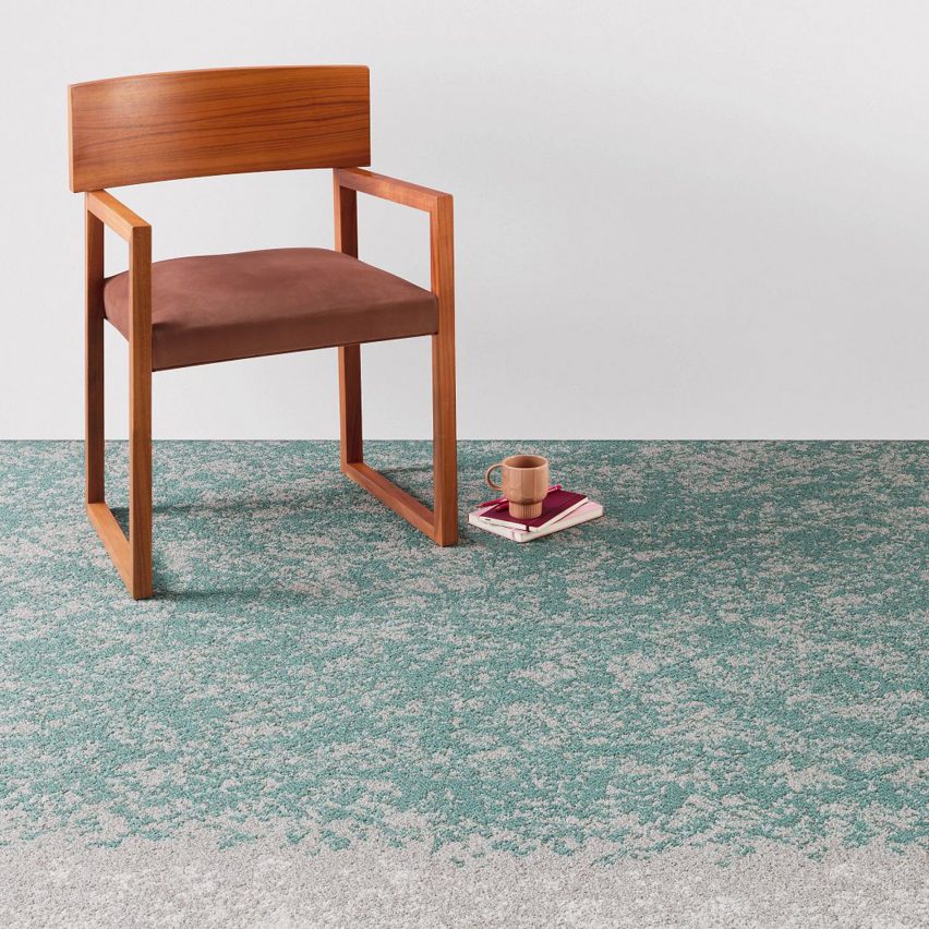 Shifting Fields carpet tiles by Shaw Contract with an orange chair