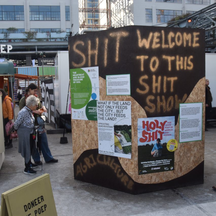 An outdoor installation with a wooden poster board