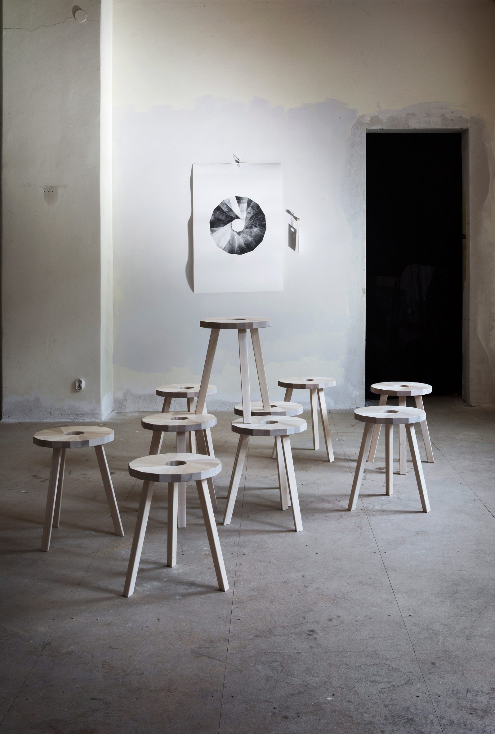 Multiple Lilla Snåland stools in a pale, industrial interior setting 