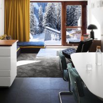 An open plan living and dining room with Bauhaus colours
