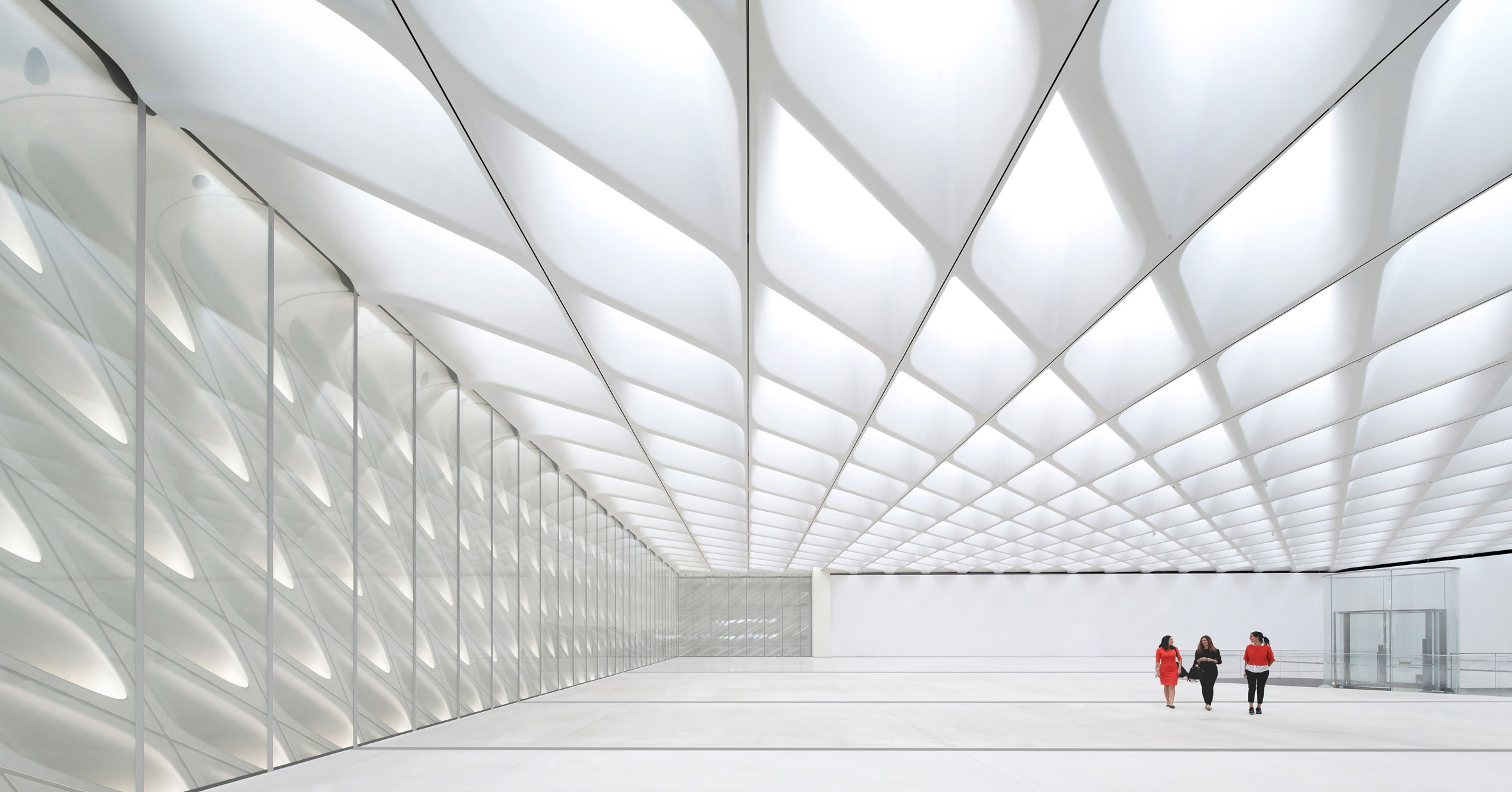 Gallery space flooded with light coming in through the perforated ceiling and walls