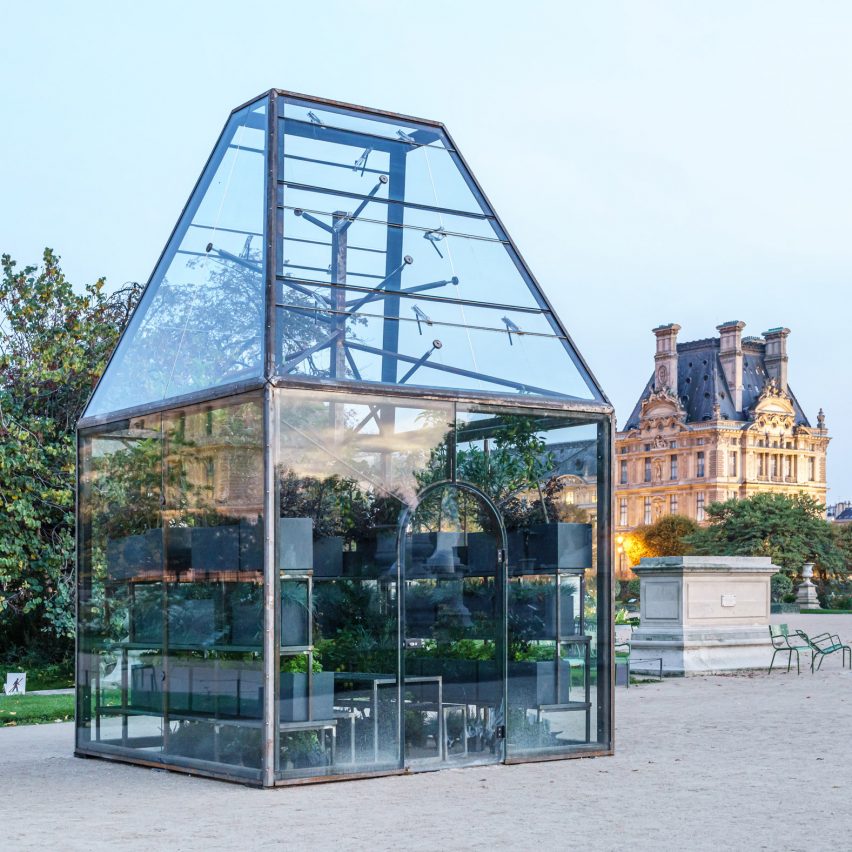 Glass pavilion with trapezoidal roof