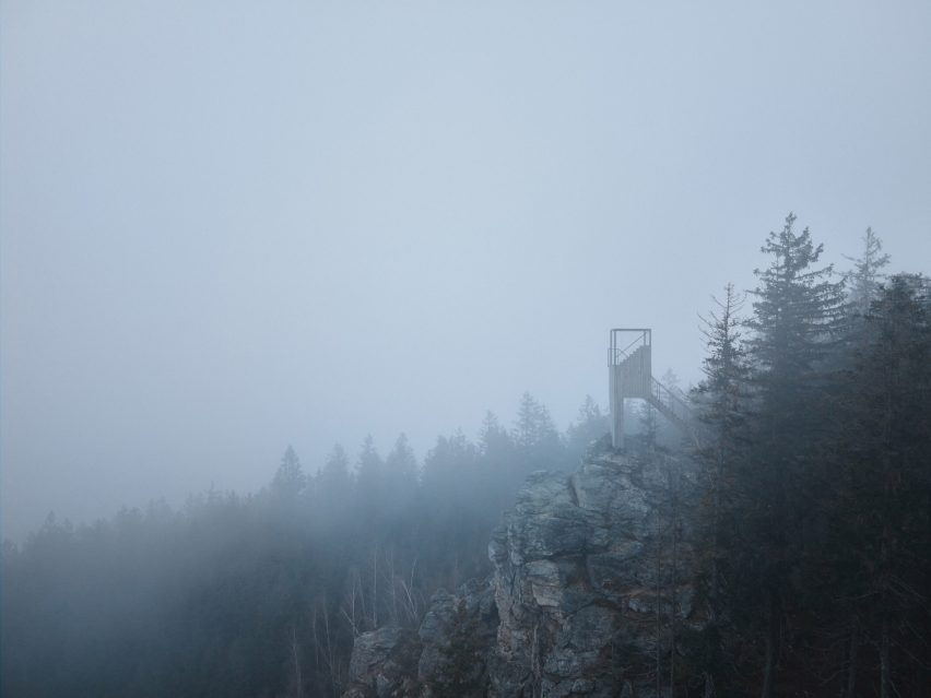 Lookout tower in a cloudy forest