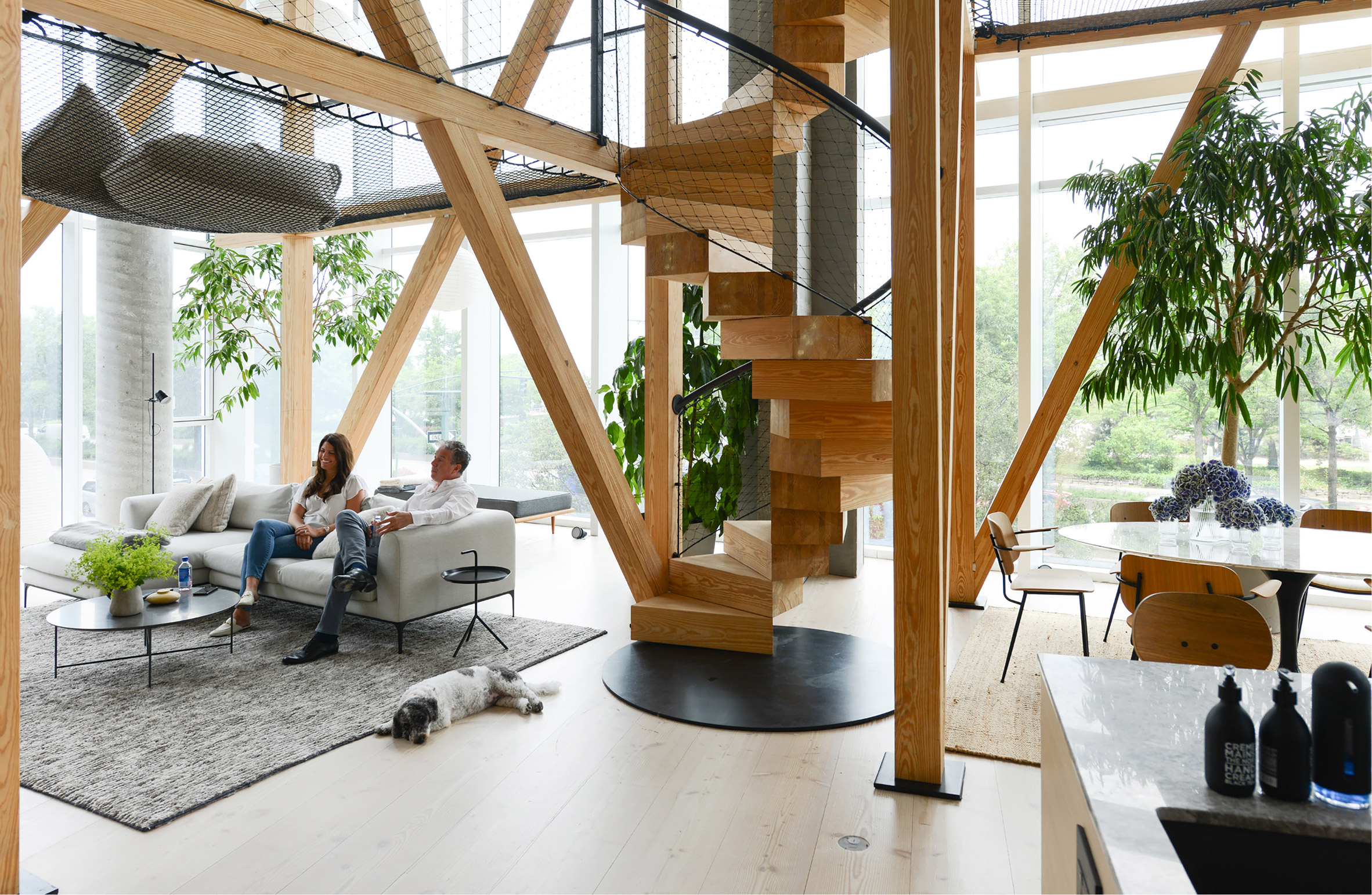 Double-height living space featuring timber structures