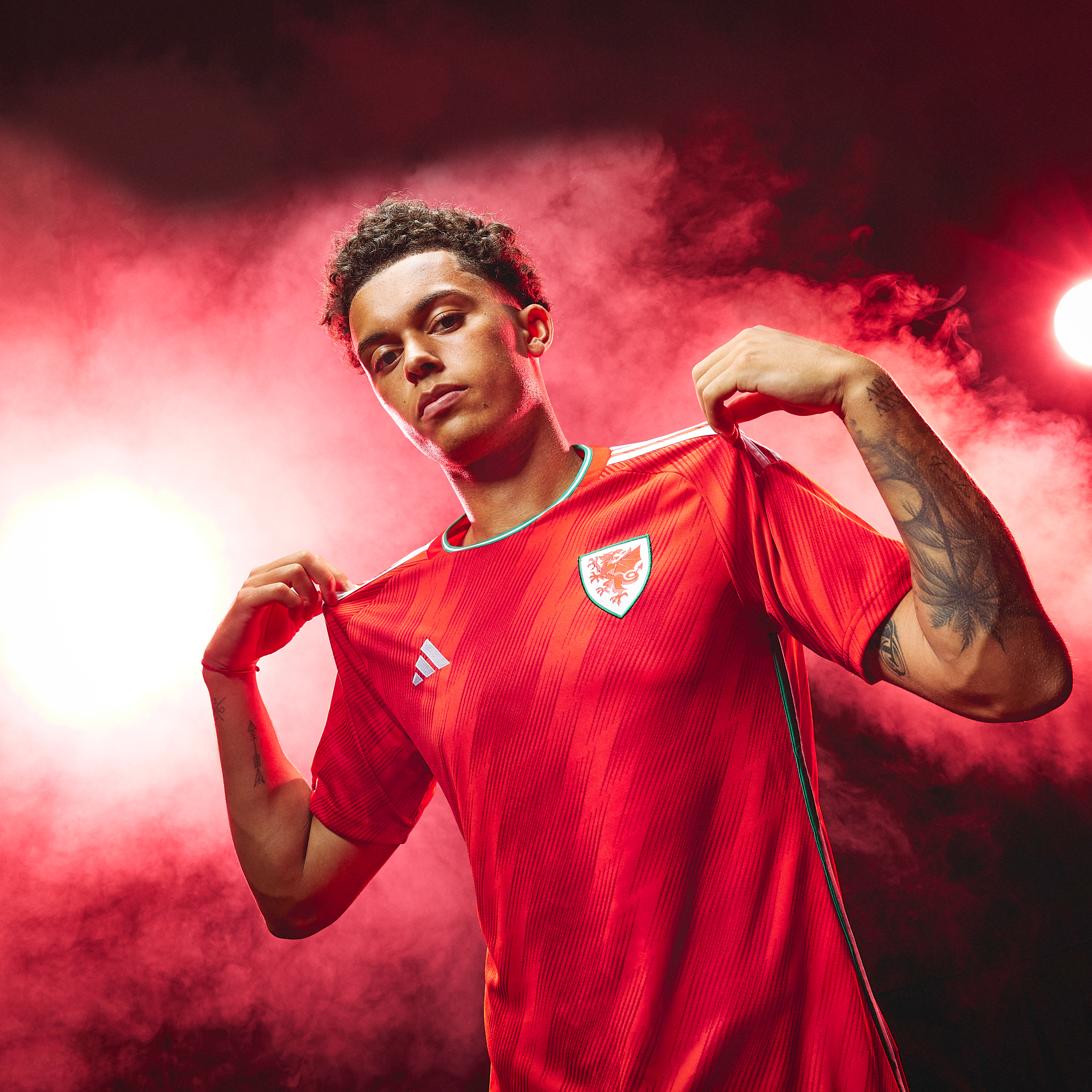 A model wearing a red football top