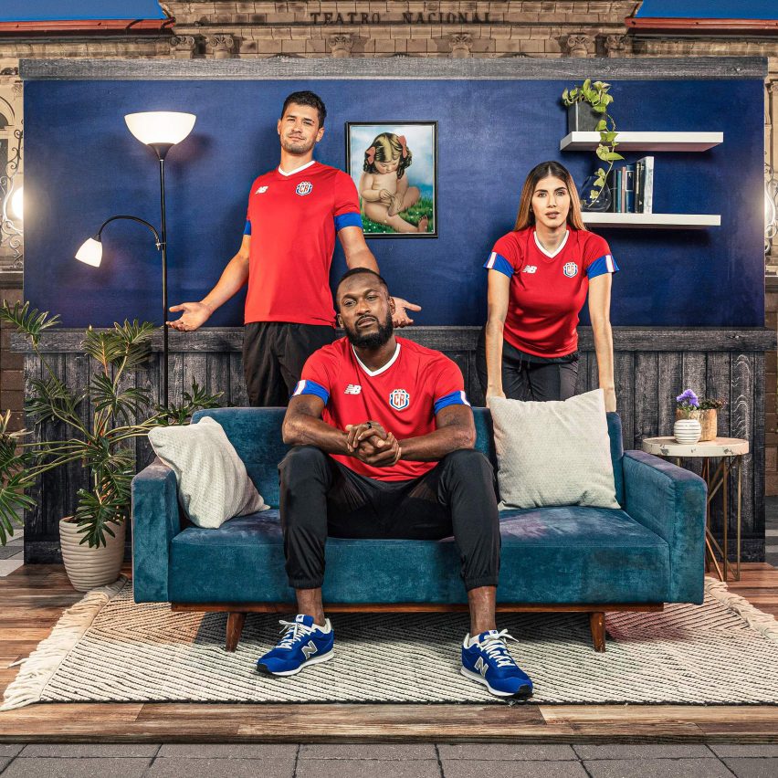 Three models wearing New Balance football kits
