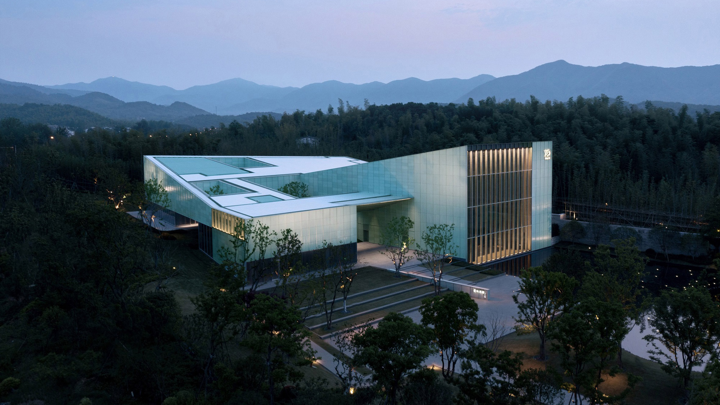 GOA insets mono-pitched theatre into bamboo forest in China