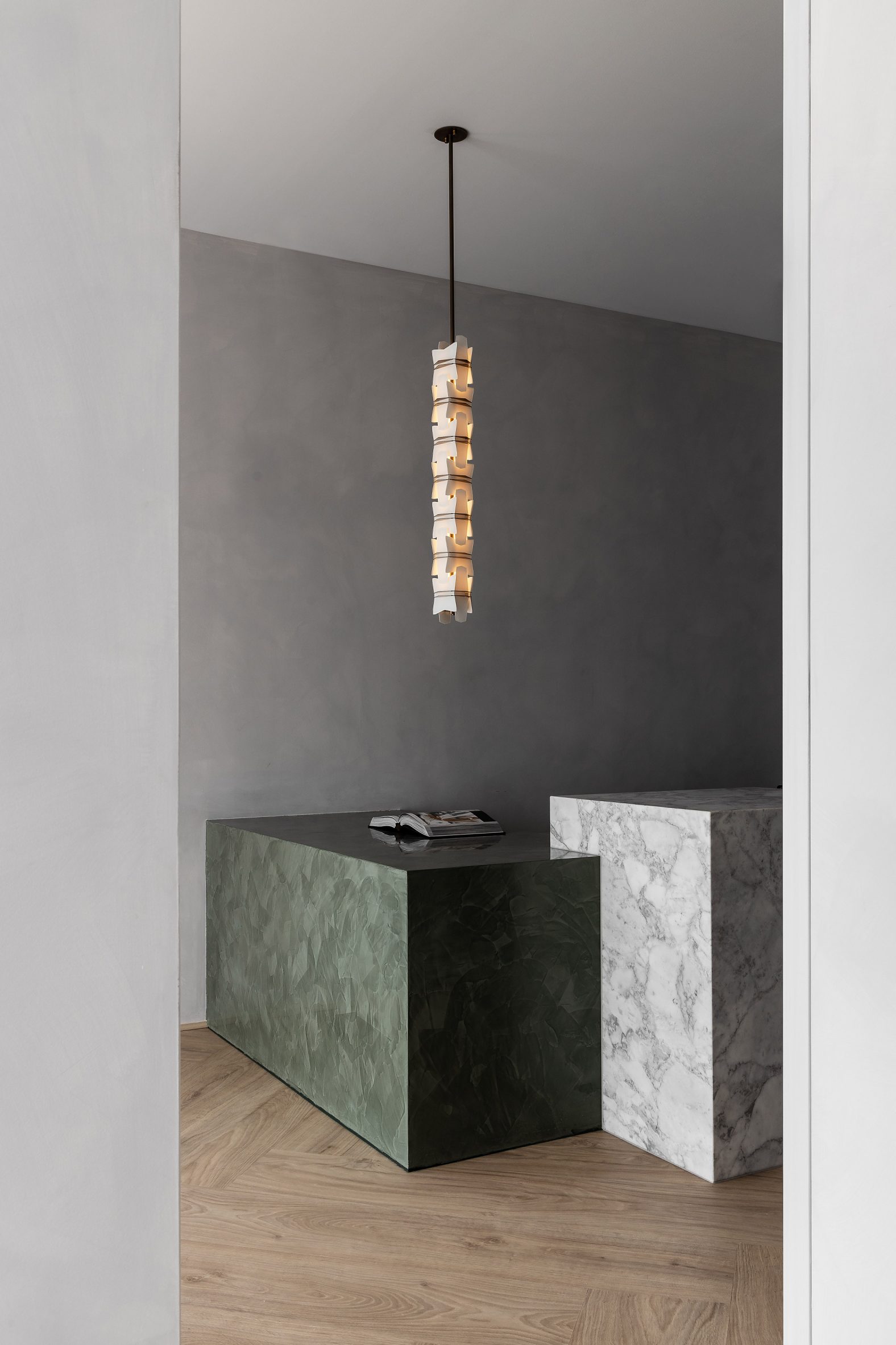 Marble reception desk in Youth Lab 3.0 clinic interior design by Nickolas Gurtler