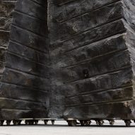 Rough hewn bluestone boulders of Mike Hewson's Rocks on Wheels playground sculpture in Melbourne