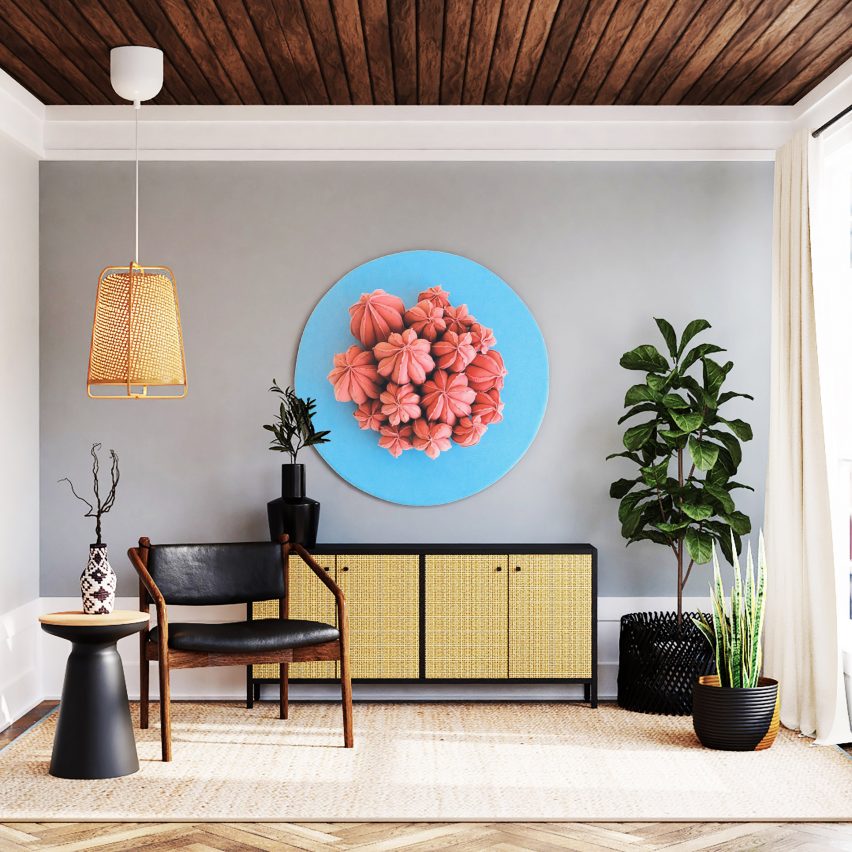 A living room featuring a circular painting of a plant