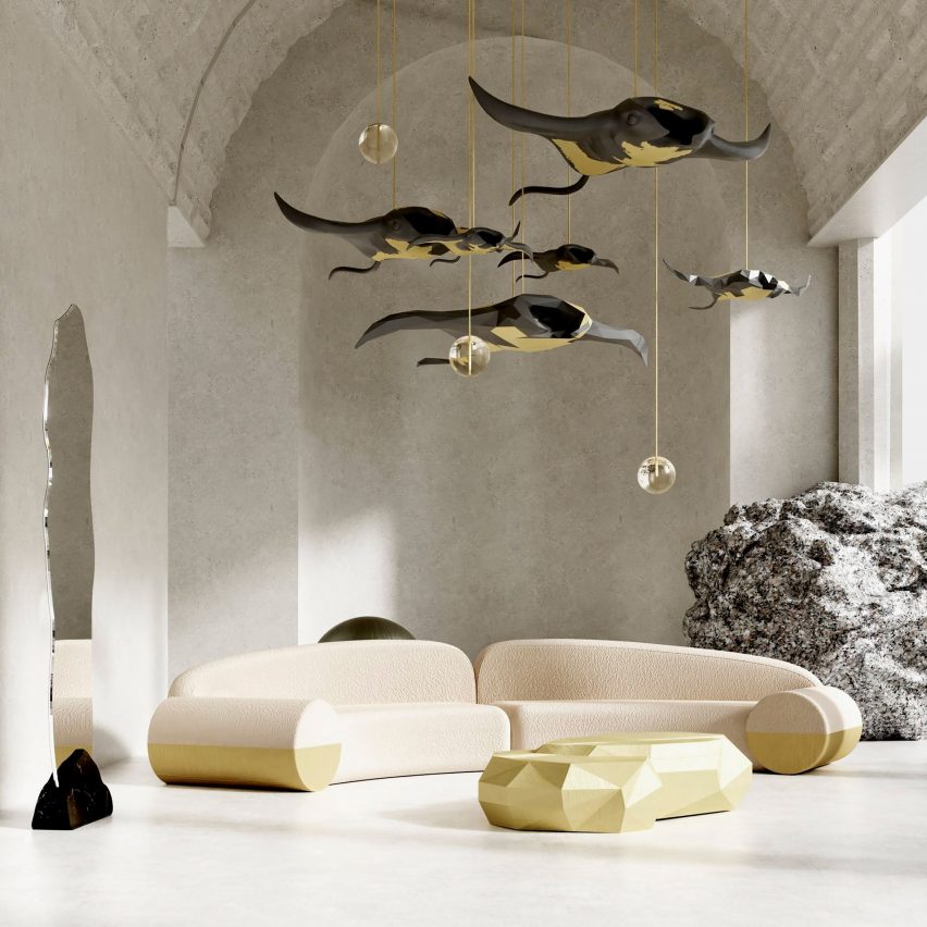 A sculpture referencing sea creatures that is hanging in a living room sapce