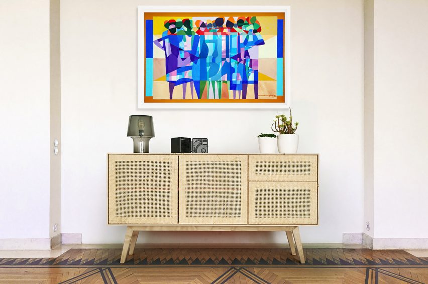 A living room featuring an artwork above a sidetable