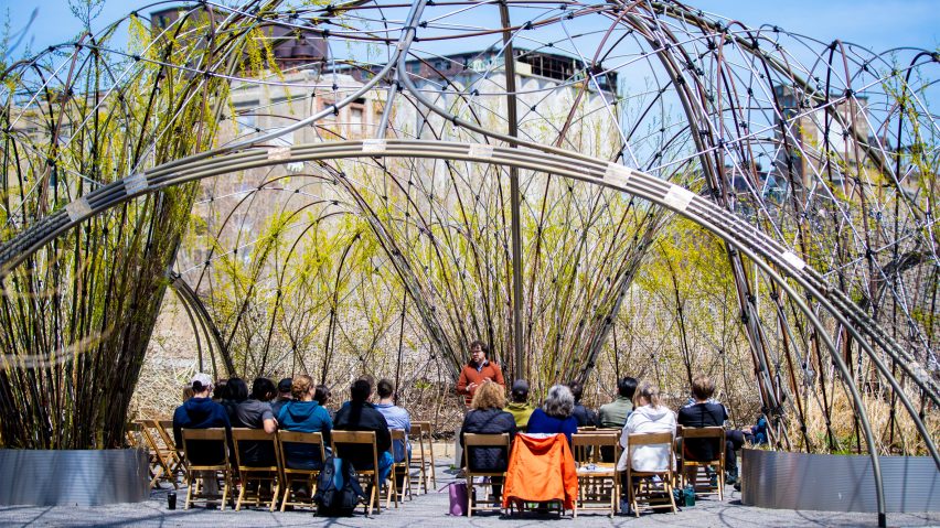 Image of a Trellis with people sat under it