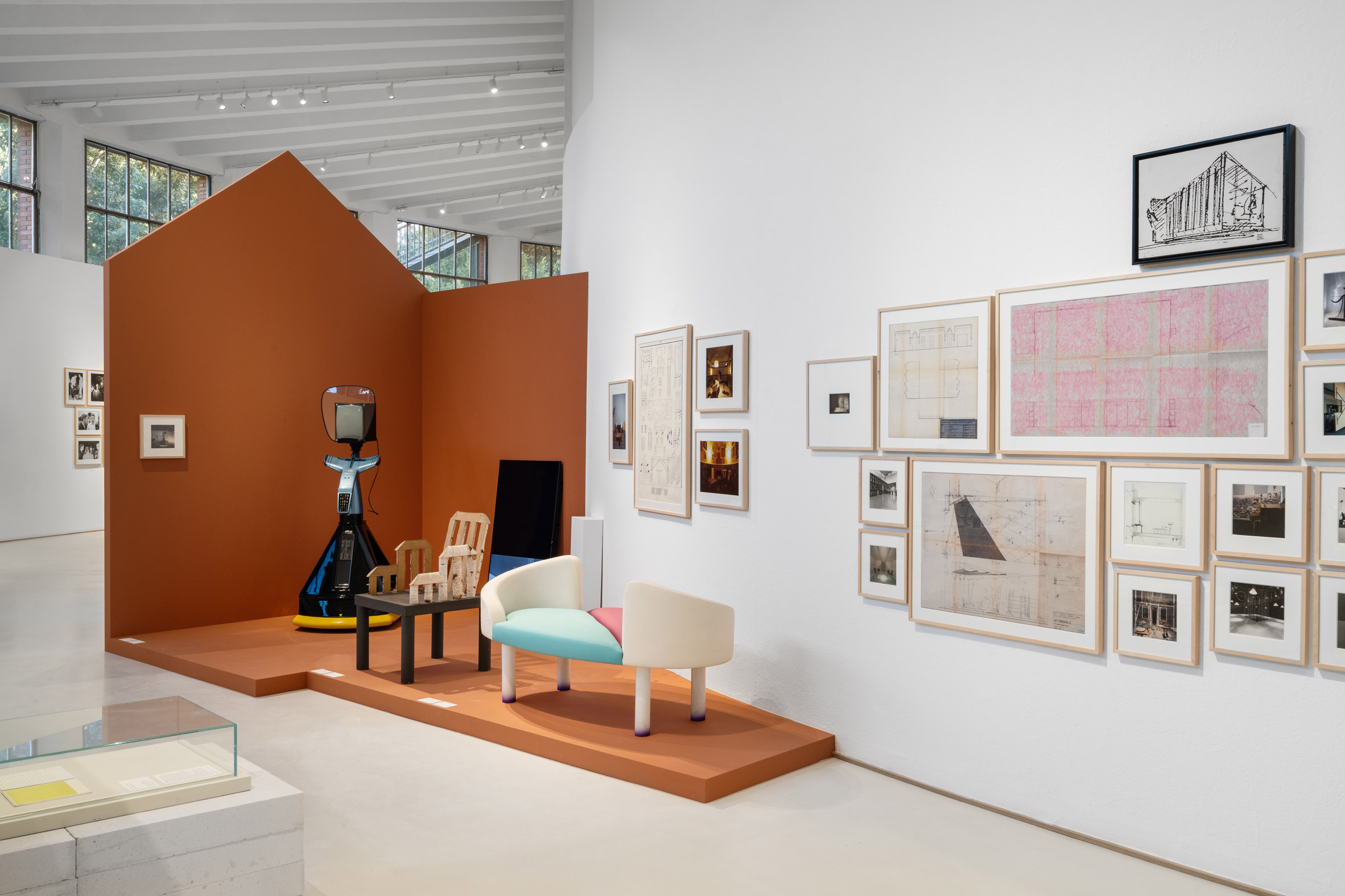 An exhibition showcasing the work of Italian designers, including chairs and artworks