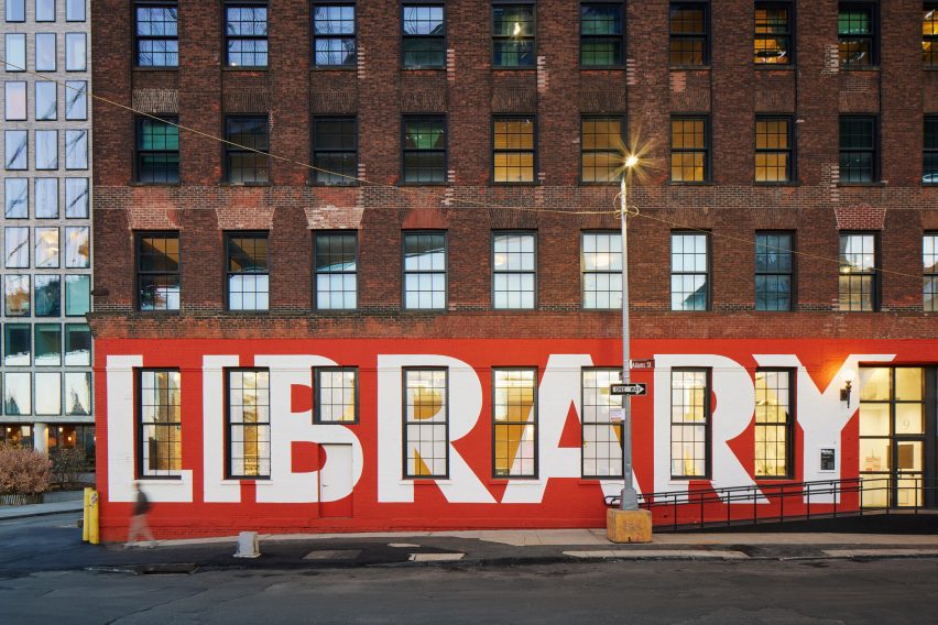 Adams Street Library facade with library painted in white letters on red background