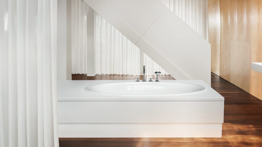 White bath in bright, warm interior