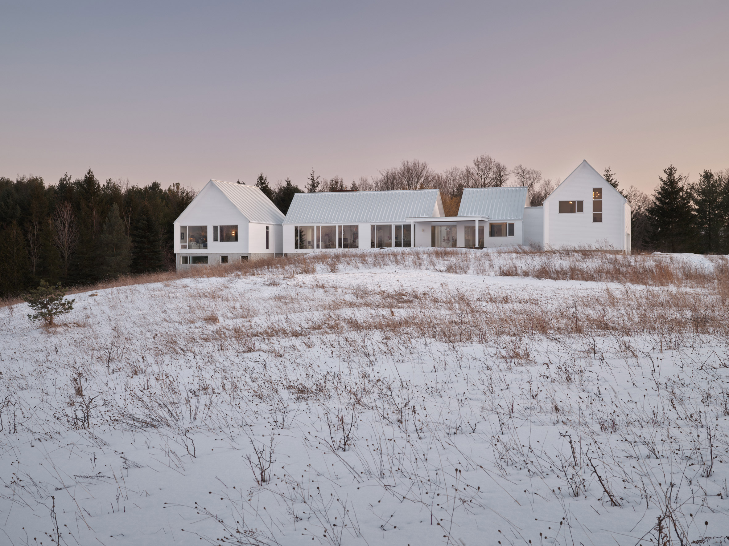 All white home on snowy hill in Ontario