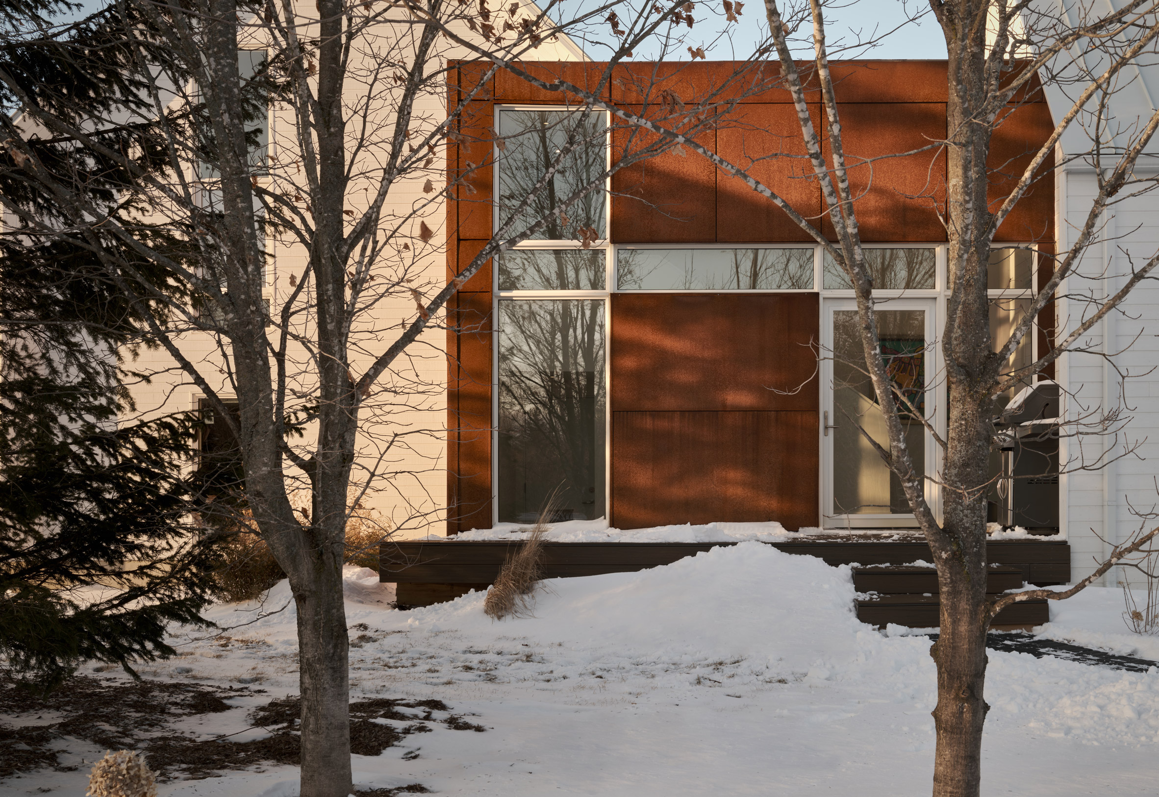 Weathering steel section on gabled home
